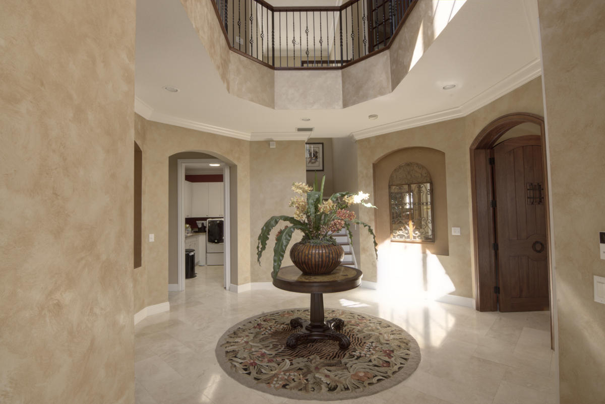 17106 Bay Street Jupiter, FL 33477 - Photo 3 of 52 a room with a chandelier and a chandelier