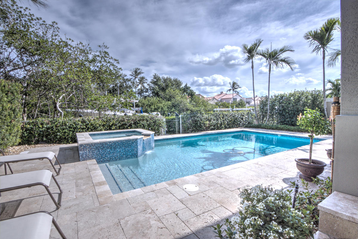 17106 Bay Street Jupiter, FL 33477 - Photo 31 of 52 a view of a swimming pool with a patio