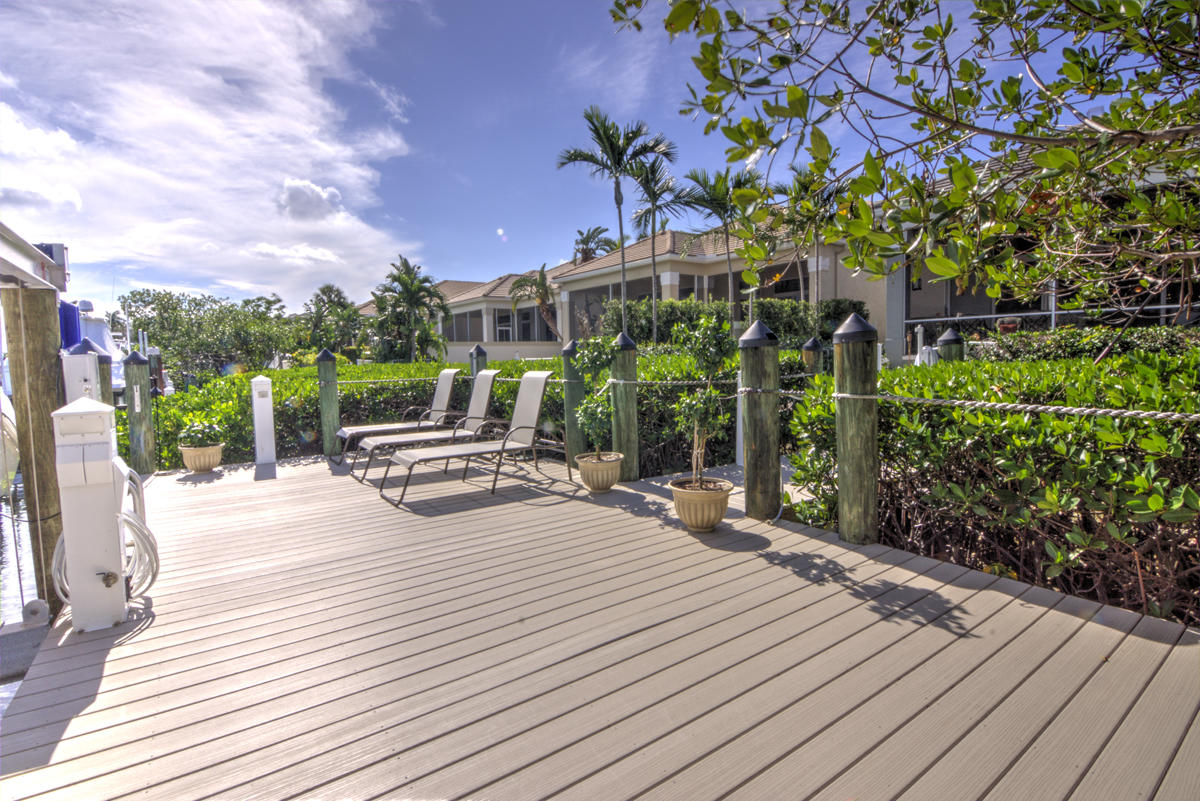 17106 Bay Street Jupiter, FL 33477 - Photo 33 of 52 a view of a backyard with sitting area