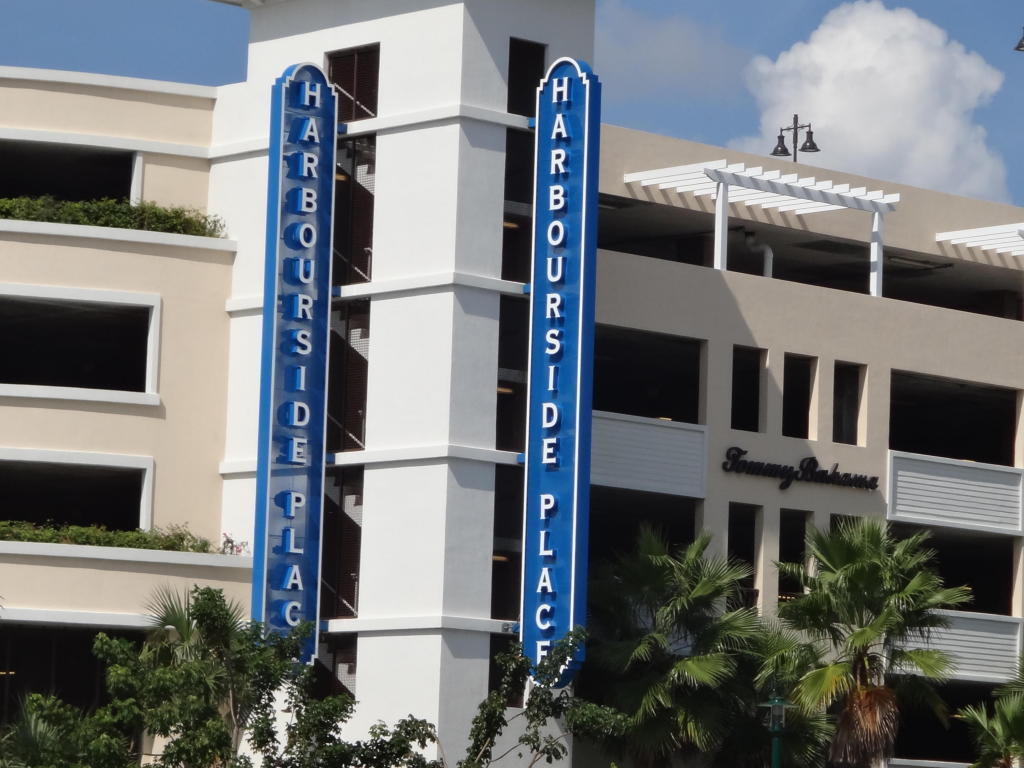 17106 Bay Street Jupiter, FL 33477 - Photo 45 of 52 a kitchen with a refrigerator and potted plants