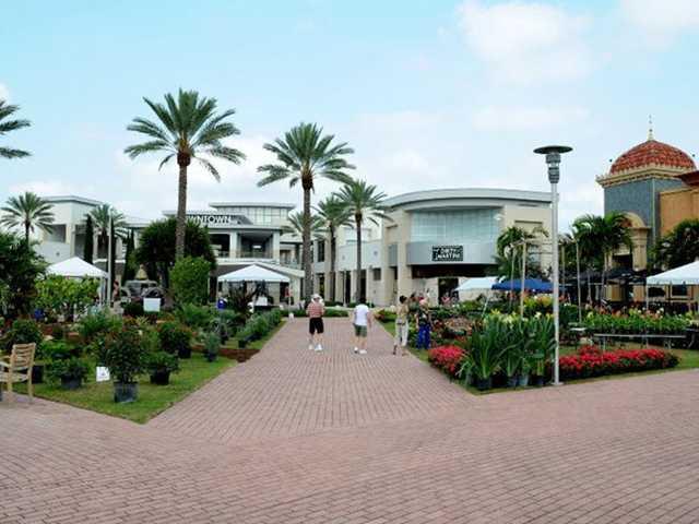 17106 Bay Street Jupiter, FL 33477 - Photo 50 of 52 a front view of a house with garden