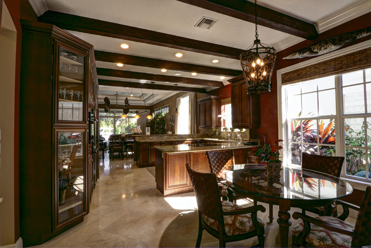 17106 Bay Street Jupiter, FL 33477 - Photo 7 of 52 a view of a dining room with furniture and chandelier