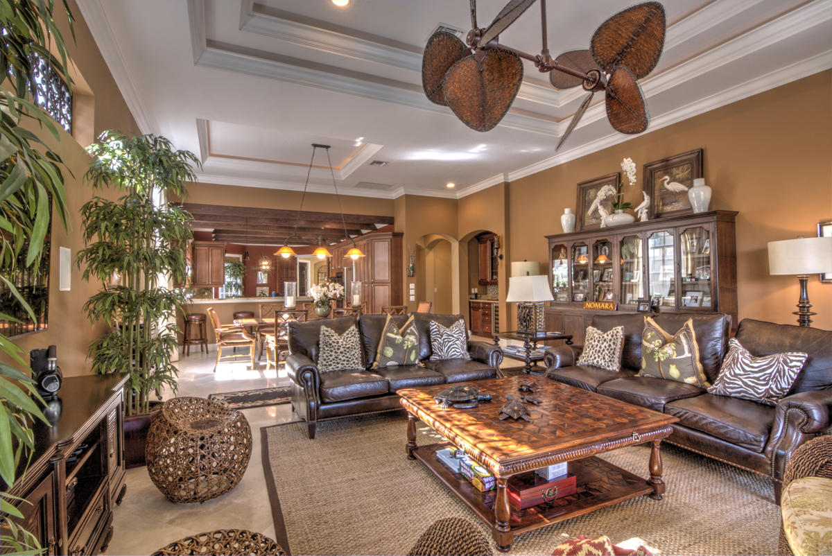 17106 Bay Street Jupiter, FL 33477 - Photo 10 of 52 a living room with patio furniture and a chandelier