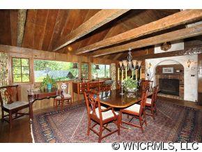 1184 Hunting Country Road Tryon, NC 28782 - Photo 5 of 12 a dining room with furniture and a floor to ceiling window