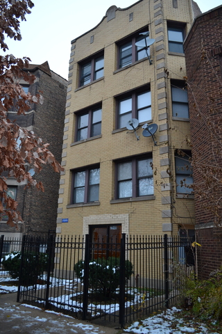 a view of a brick building and many windows