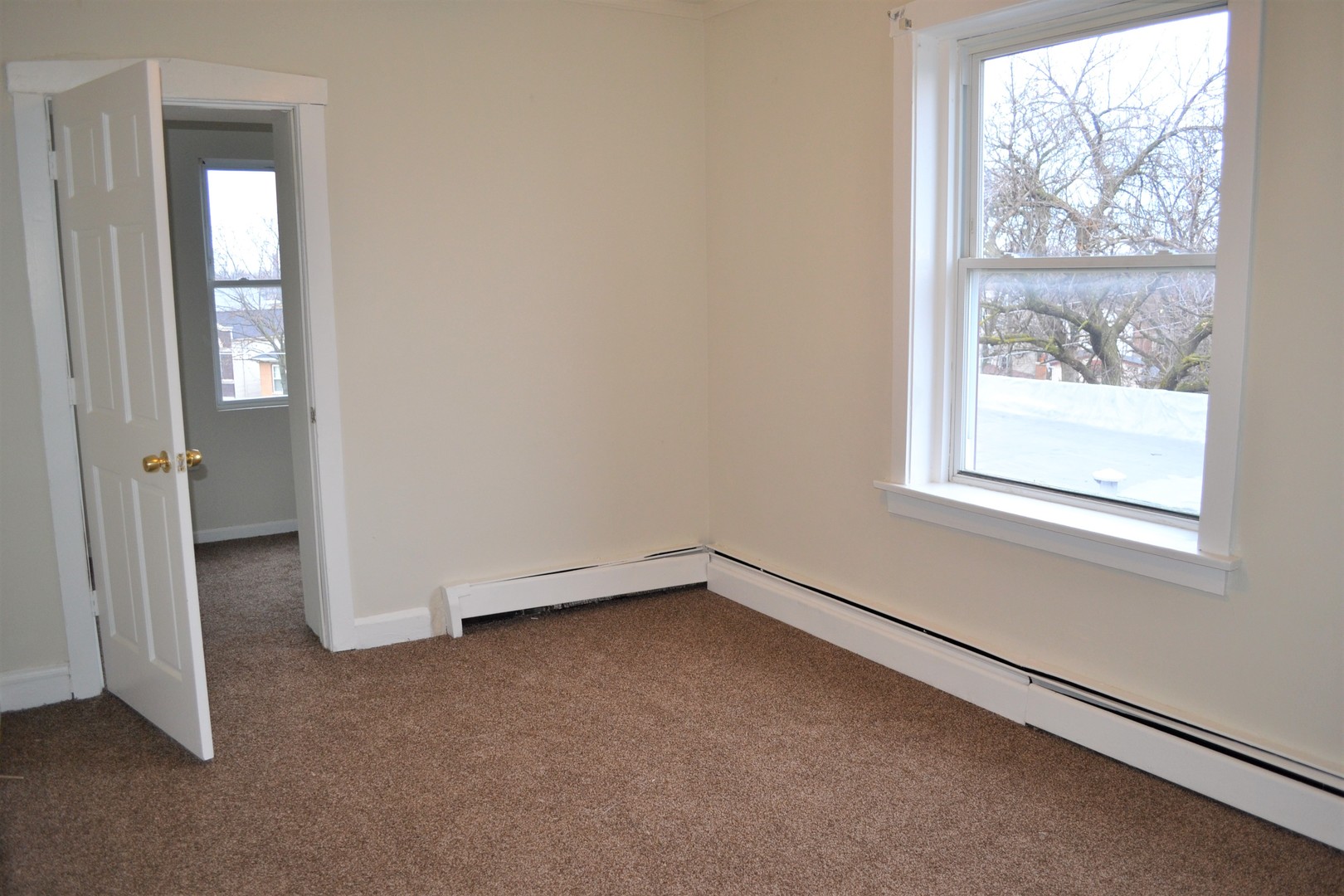 2948 West Nelson Street, Unit 3 Chicago, IL 60618 - Photo 11 of 14 an empty room with windows