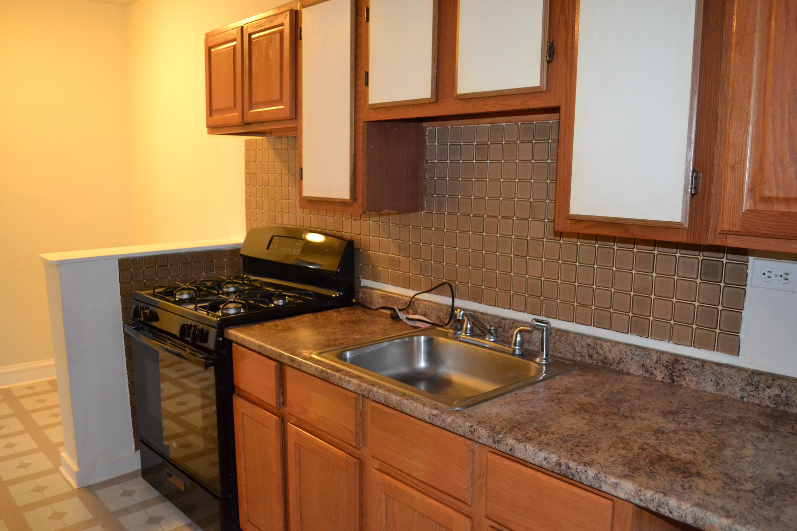 2948 West Nelson Street, Unit 3 Chicago, IL 60618 - Photo 5 of 14 a kitchen with sink and cabinets