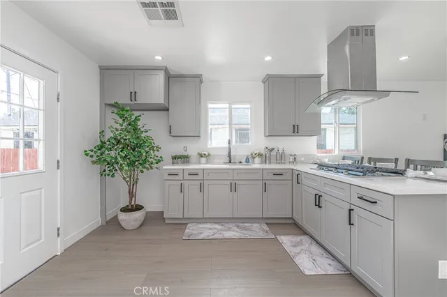 a kitchen with sink and cabinets