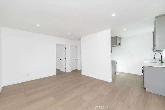 a view of a kitchen with wooden floor