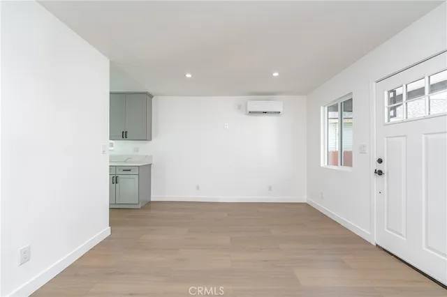 a view of a kitchen with a sink and a refrigerator