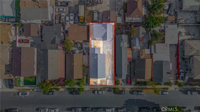 a view of a street with tall buildings