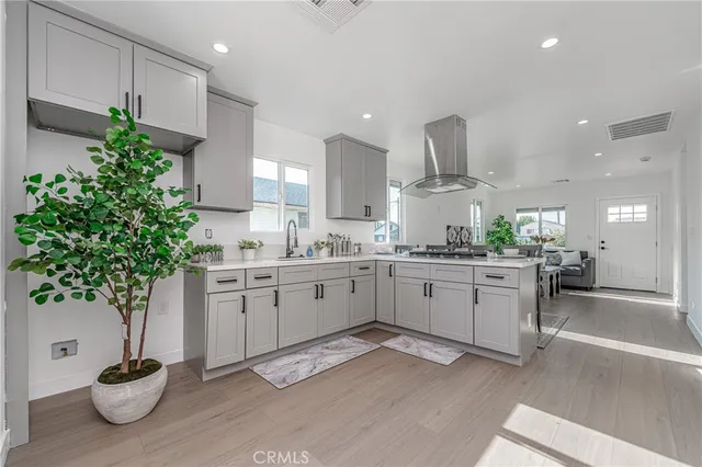 a kitchen with sink and cabinets