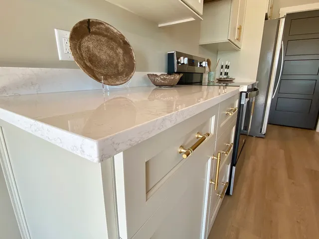 a kitchen with kitchen island a sink table and chairs