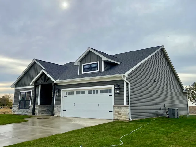 a view of house with backyard