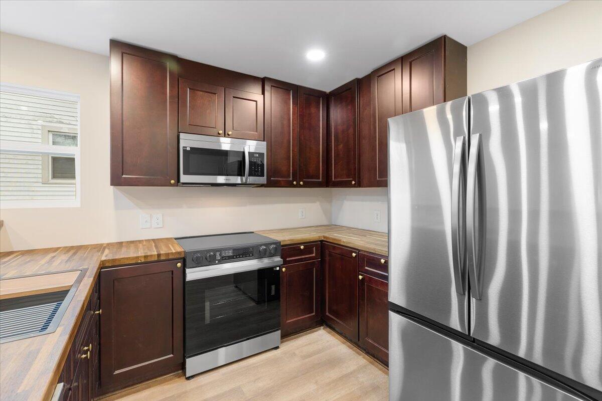 127 State Pulaski, VA 24301 - Photo 18 of 35 a kitchen with stainless steel appliances granite countertop a refrigerator stove and sink