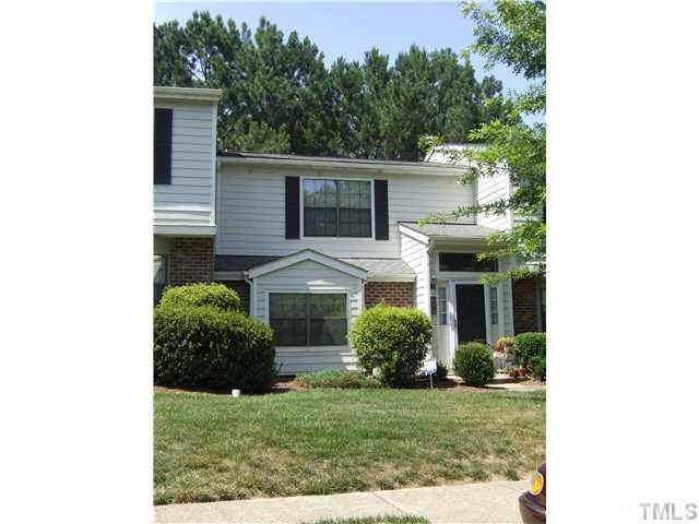 7707 Falcon Rest Circle, Unit 7707 Raleigh, NC 27615 - Photo 1 of 19 a front view of a house with a yard