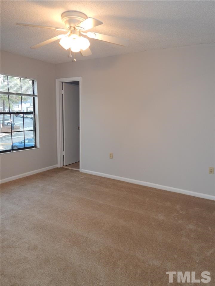 7707 Falcon Rest Circle, Unit 7707 Raleigh, NC 27615 - Photo 15 of 19 a view of an empty room with a window