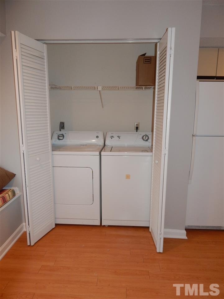 7707 Falcon Rest Circle, Unit 7707 Raleigh, NC 27615 - Photo 18 of 19 a view of storage and utility room with washer and dryer