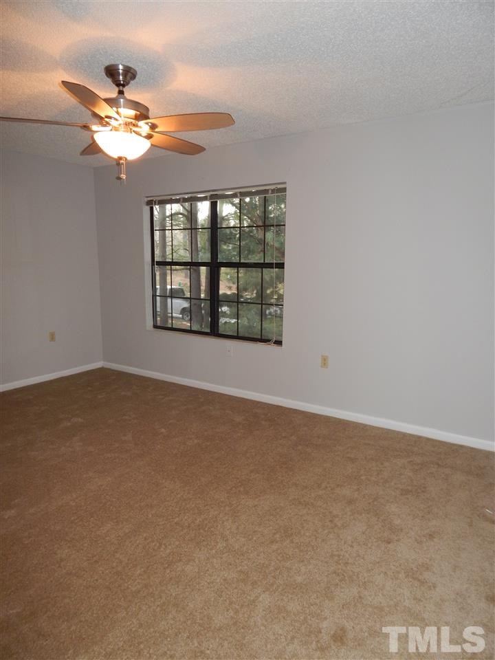 7707 Falcon Rest Circle, Unit 7707 Raleigh, NC 27615 - Photo 9 of 19 a view of an empty room with a window