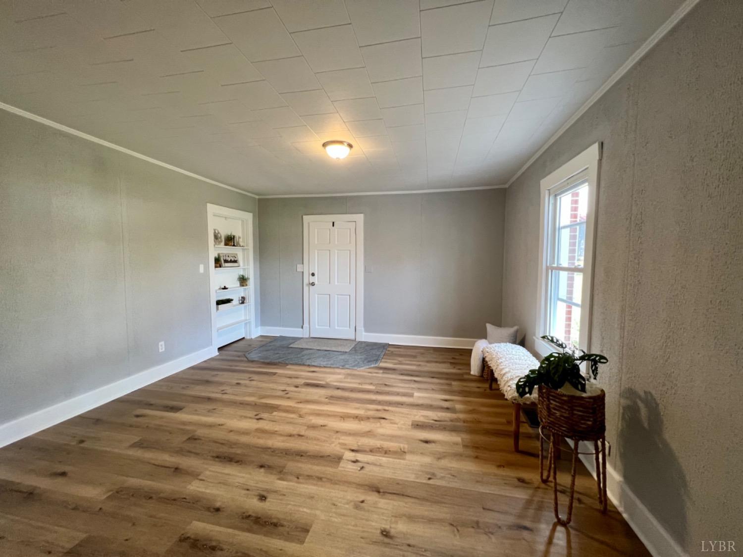 295 Little Cub Road Appomattox, VA 24522 - Photo 4 of 89 a view of a room with wooden floor and a window