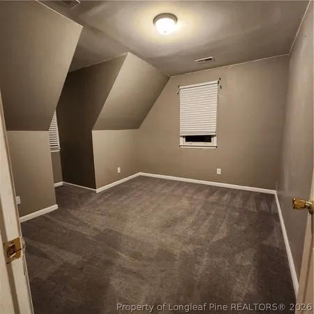 a view of entryway wooden floor and a front door