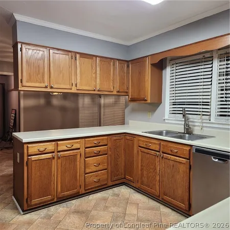 a kitchen with stainless steel appliances granite countertop a stove and a sink