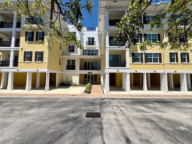 3130 West Latitude Circle, Unit 203 Delray Beach, FL 33483 - Photo 1 of 1 a view of a large building