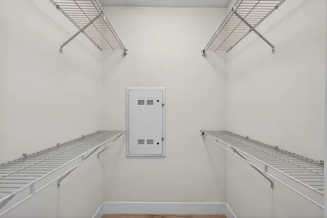 a bathroom with a granite countertop shower and a sink