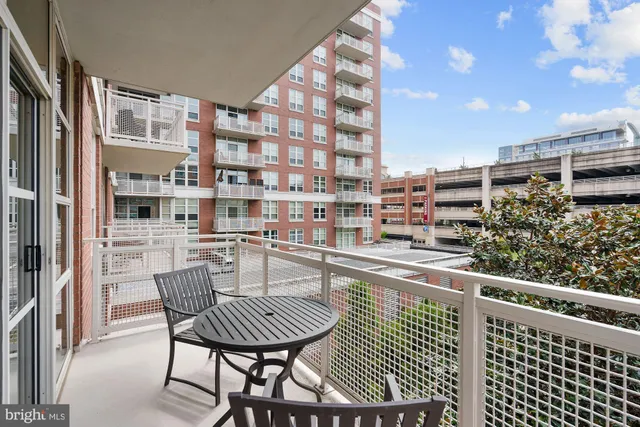 a view of a balcony with chairs