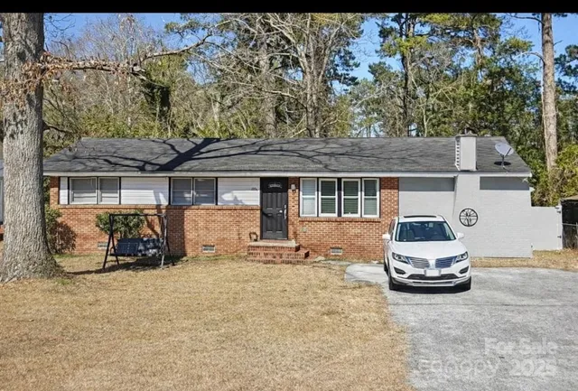 a car parked in front of a house