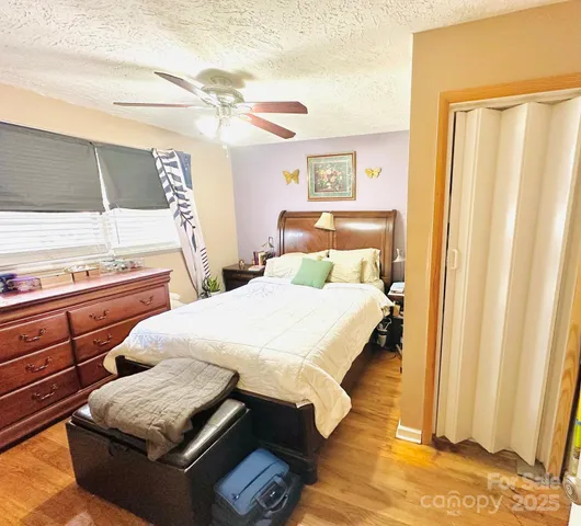 a bedroom with bed and window