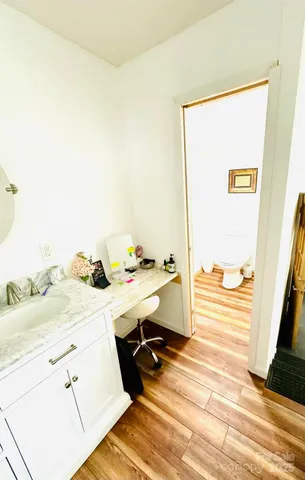 a view of a bathroom with a sink and mirror