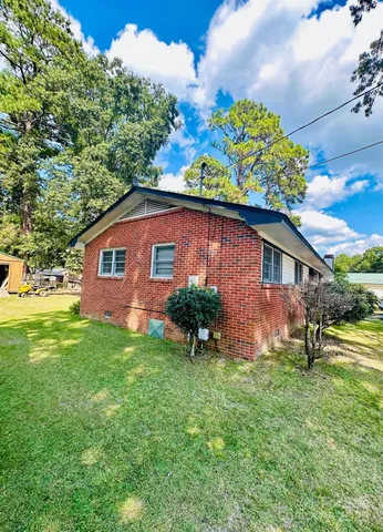 a backyard of a house with lots of green space