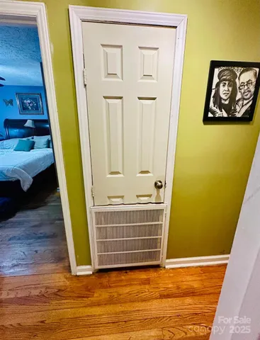 a view of front door with wooden floor