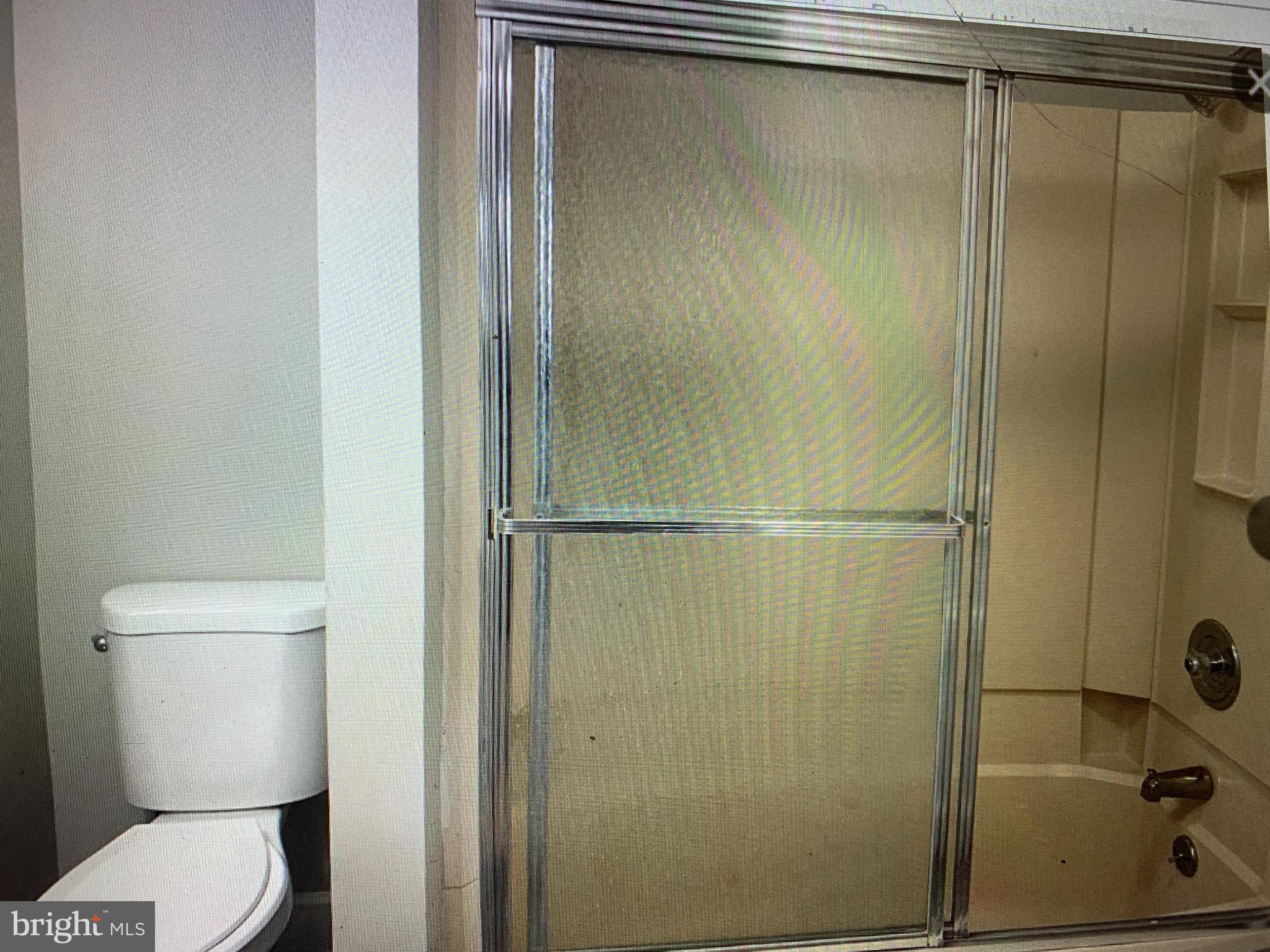 406 High Street, Unit 2 Burlington, NJ 08016 - Photo 11 of 11 a bathroom with a shower and a toilet