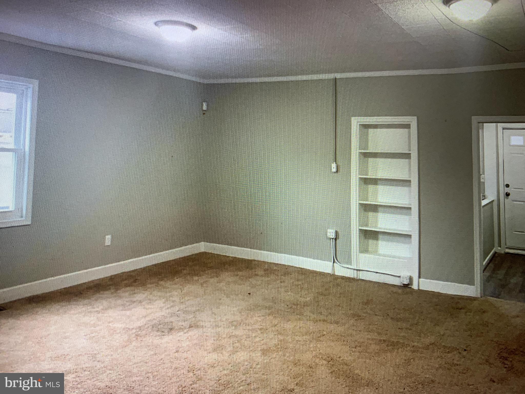 406 High Street, Unit 2 Burlington, NJ 08016 - Photo 4 of 11 an empty room with a empty space and a window