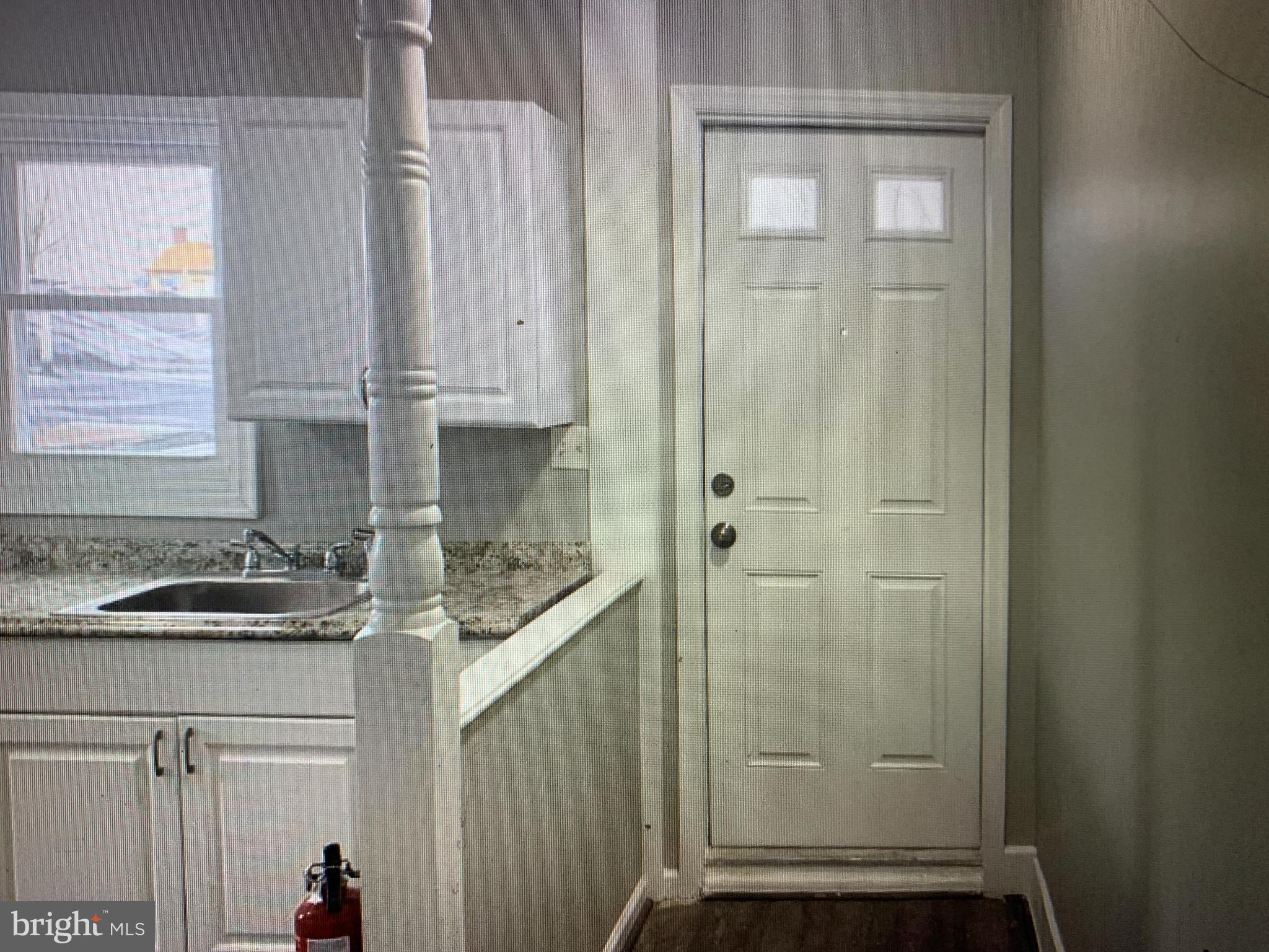 406 High Street, Unit 2 Burlington, NJ 08016 - Photo 6 of 11 a kitchen with a sink and cabinets