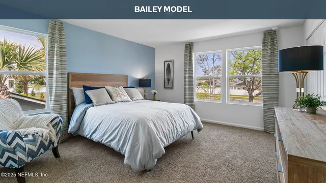 a bedroom with a bed and a desk