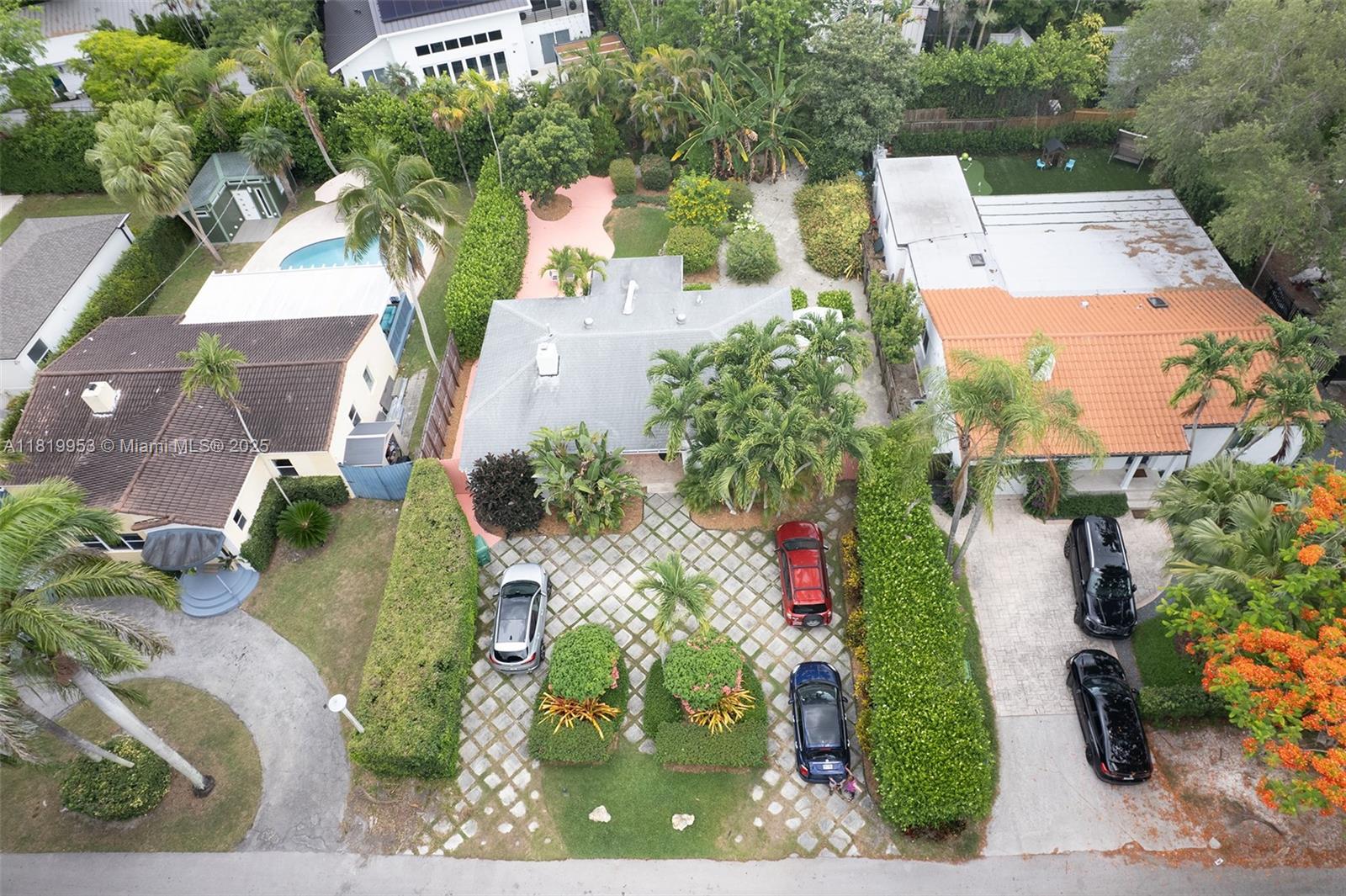 4245 Braganza Avenue Miami, FL 33133 - Photo 2 of 4 an aerial view of a house with a yard and garden