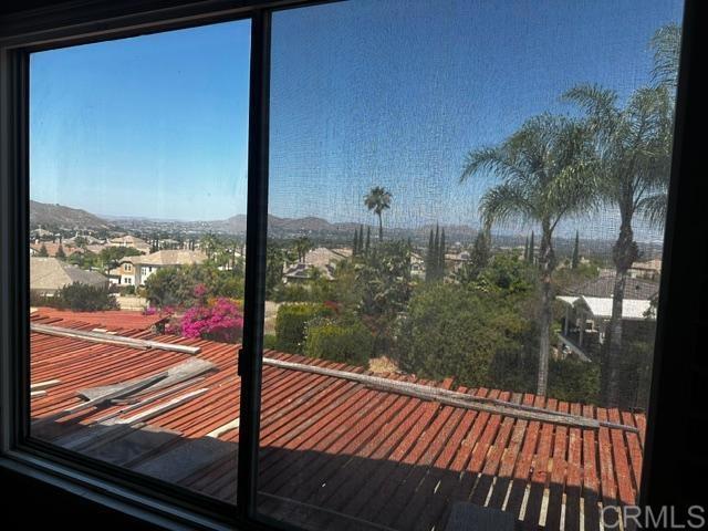 10791 Orchard View Lane Riverside, CA 92503 - Photo 7 of 7 a view of a balcony with floor to ceiling windows with wooden floor