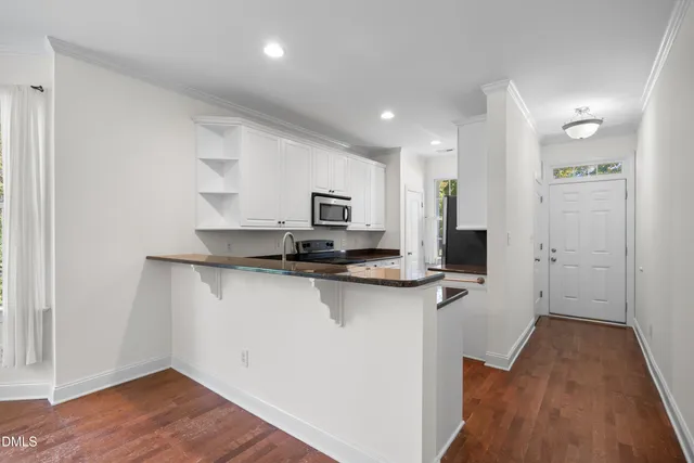 a view of a kitchen with electric appliances