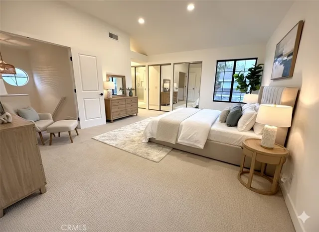 a bedroom with bed and wooden floor