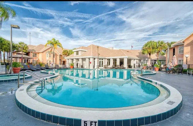 a view of a house with swimming pool