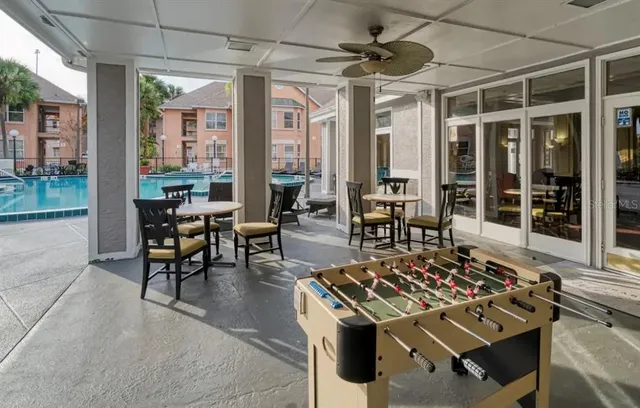 a outdoor space with patio the couches and a dining table with the view of the living room