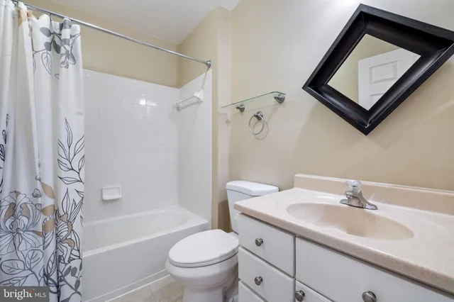 a bathroom with a sink toilet and a bathtub