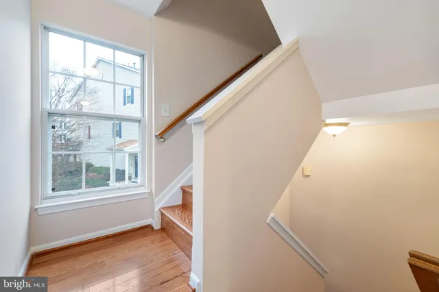 a view of entryway with window and wooden floor