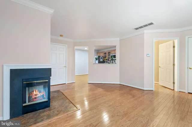 a view of an empty room and fire place