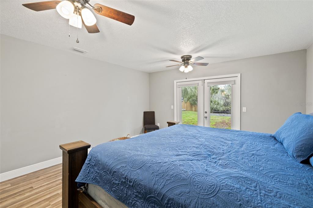 3908 Alafia Boulevard Brandon, FL 33511 - Photo 27 of 42 a bed sitting in a bedroom next to a window