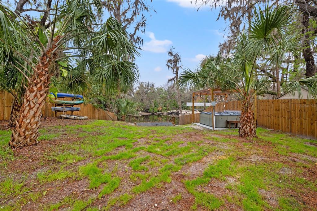 3908 Alafia Boulevard Brandon, FL 33511 - Photo 8 of 42 a backyard of a house with table and chairs