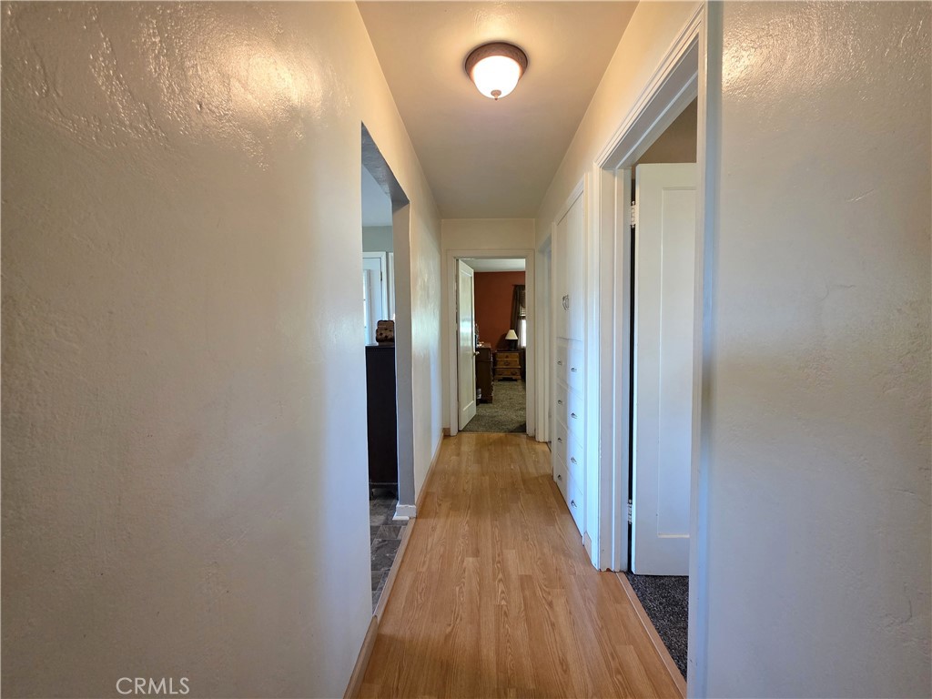 23773 River Road Corning, CA 96021 - Photo 18 of 64 a view of a hallway with a wooden floor